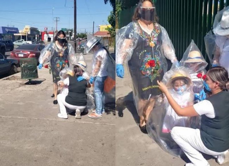 Niñas se forran en bolsas de plástico para poder abrazar a su mamá enfermera (VIDEO)