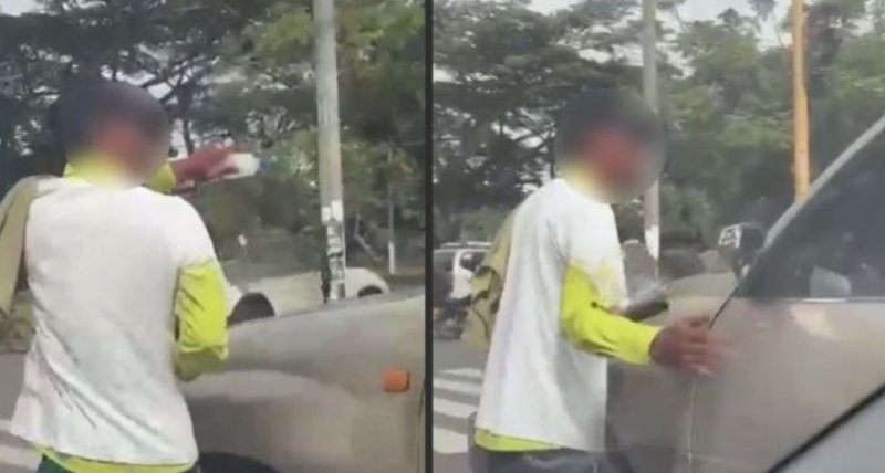Joven agrede a conductor por negarse a recibir servicio de limpia parabrisas en semáforo (VIDEO)y