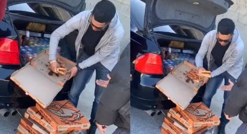 Joven reparte refrescos y pizza a personas en situación de calle (VIDEO)